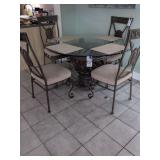 54" Metal and Glass Table And 4 Chairs