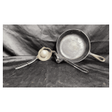 cast iron skillet and a vintage lemon or citrus juicer.