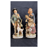 A pair of vintage porcelain figures