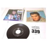 2 Vintage Elvis Presley 45s in original sleeves ("Unchained Melody/Loving You" & Surrender/Lonely Man") & additional 45 stored in sleeve