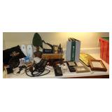 Variety of Items: Basket, Sunglasses, Wall Art pieces, Electric Power Strip, Mini Tape Recorded with additional tapes, Notebooks, Clock Etc.