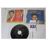 2 Vintage Elvis Presley 45s in original sleeves ("Trouble/What