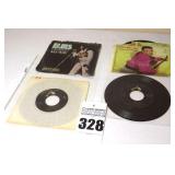2 Vintage Elvis Presley 45s in original sleeves ("My Way/All Shook Up" & "Let me Be Your Teddy Bear/Blue Christmas") & 2 additional 45s stored in page protectors   - 4 total