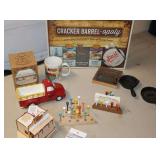 Variety of Vintage Cracker Barrel Items: Cracker Barrelopoly Game (New still wrapped), 2 Tee Games with cheat sheet, Cup, Truck, Wood restaurant display, 2 Iron Skillets etc.