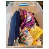 Storage Tote Containing Assorted Bags, Linens, and HoMedics UV Clean Portable Sanitizer
