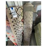 Rolled Area Rug with Geometric and Abstract Pattern