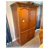 Large Wooden Armoire with Double Doors and Lower Storage Compartment