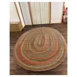 Large Oval Braided Area Rug with Multi-Color Earth Tone Pattern