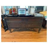 Wooden Storage Chest with Carved Details and Turned Feet