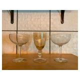 Assorted Glassware Lot Including Amber Etched Wine Glass and Two Engraved Cocktail Coupes