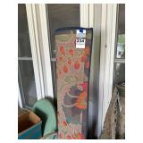 Rolled Area Rug with Floral Motif and Multi-Colored Design