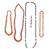 4 Necklaces of Coral, Amber, and Resin