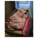 flat top trunk full of quilts and blankets