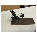 Metal art figure man on a donkey