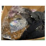 Box of misc scarves, hats, fidget spinners