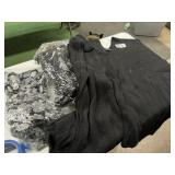 2 black ponchos and an infinity scarf