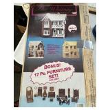 The Whitney all wood dollhouse has been opened