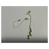 Small chain with charm  needs repaired marked 14k