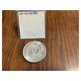 1921 Morgan silver dollar stamped 100th