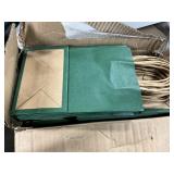 Box of small green gift bags