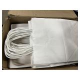 Box of white gift bags