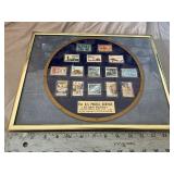 The u.s. postal service bystory plate in a frame