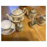 Tea cups and teapots one has been repaired