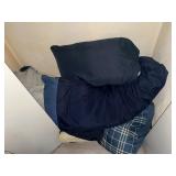Pillows in bottom of closet