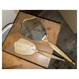 Vanity mirror and hair brush