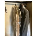 Assorted suit jackets in closet