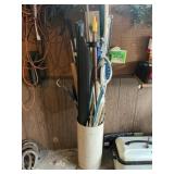 Barrel of misc. mops and such