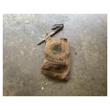 Tent stakes and rope, in a vintage burlap bag