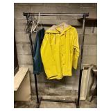 Clothes rack w/ sz large rain pants and sz large