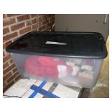 Tote w/lid of Christmas decorations and stockings
