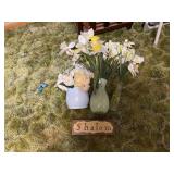 Faux flowers with greeting sign