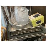 Pans, plastic bowls and stoneware baker