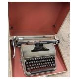 Vintage Olympia type writer and case