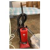 Ironing board and dirt devil sweeper