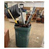 Garbage can full of yard supplies