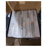 White wave interlocking backsplash tile.