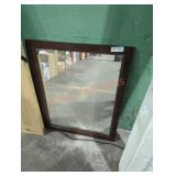 Brown wooden framed wall mirror