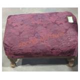 Maroon upholstered ottoman