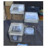 Trio of glass food canisters.