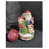 Holiday musical with revolving stand.