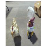 Metal rooster and wooden carved rooster.