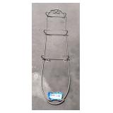 Vintage wall rack meant for decorative plates.