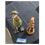 Wooden duck and bird figurines.