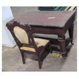 Vintage desk on wheels and chair.