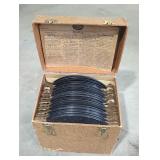 Vintage record holder with records inside.