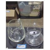 Pair of clear glass pitchers.